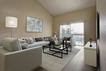 A living room with a couch and a table 